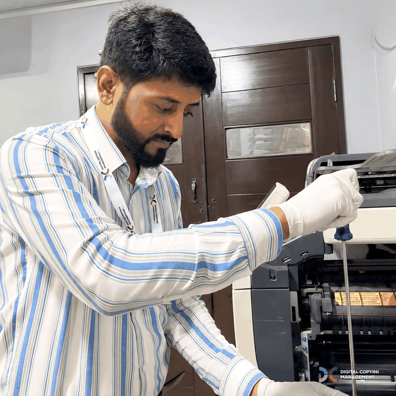 Close-up of copier maintenance by DCM technician