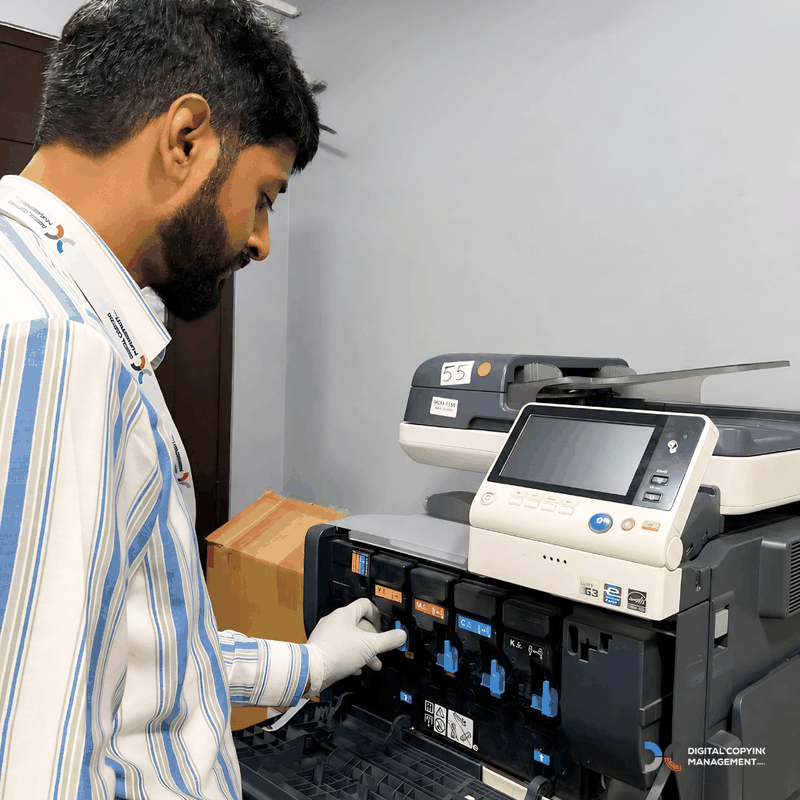 DCM engineer servicing colour copier